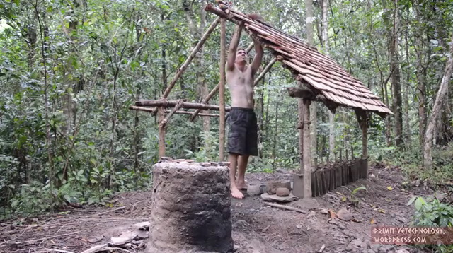 a crazy man building natural cottage (2)