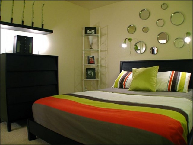 personable-light-green-bedroom-with-fascinating-rounded-small-mirror-decoration-ideas-plus-nice-dark-wood-storage-design-909x682