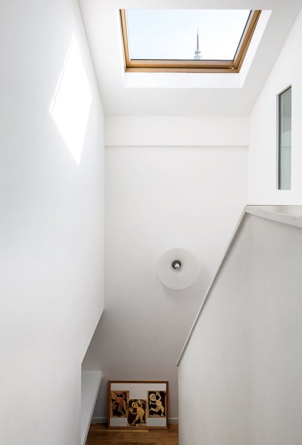 the-outer-limits-paris-prefab-home-velux-skylight-staircase-light-fixture